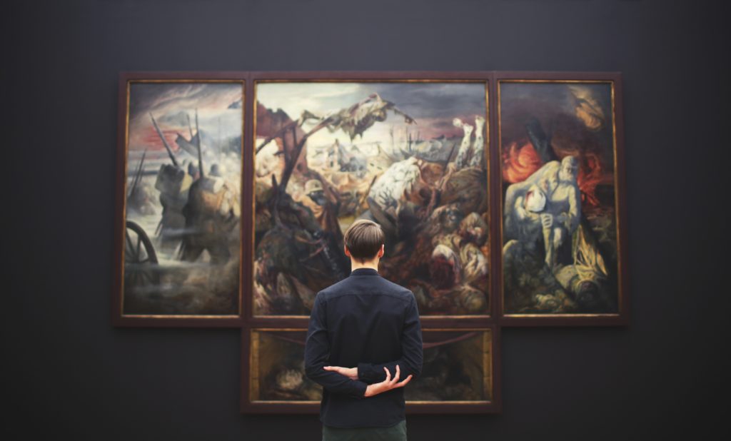 Man Analyzing Art