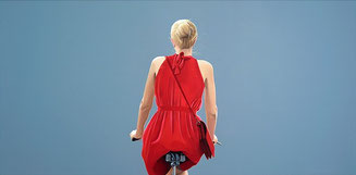 "Cyclist in red dress" by Sabine Liebchen
